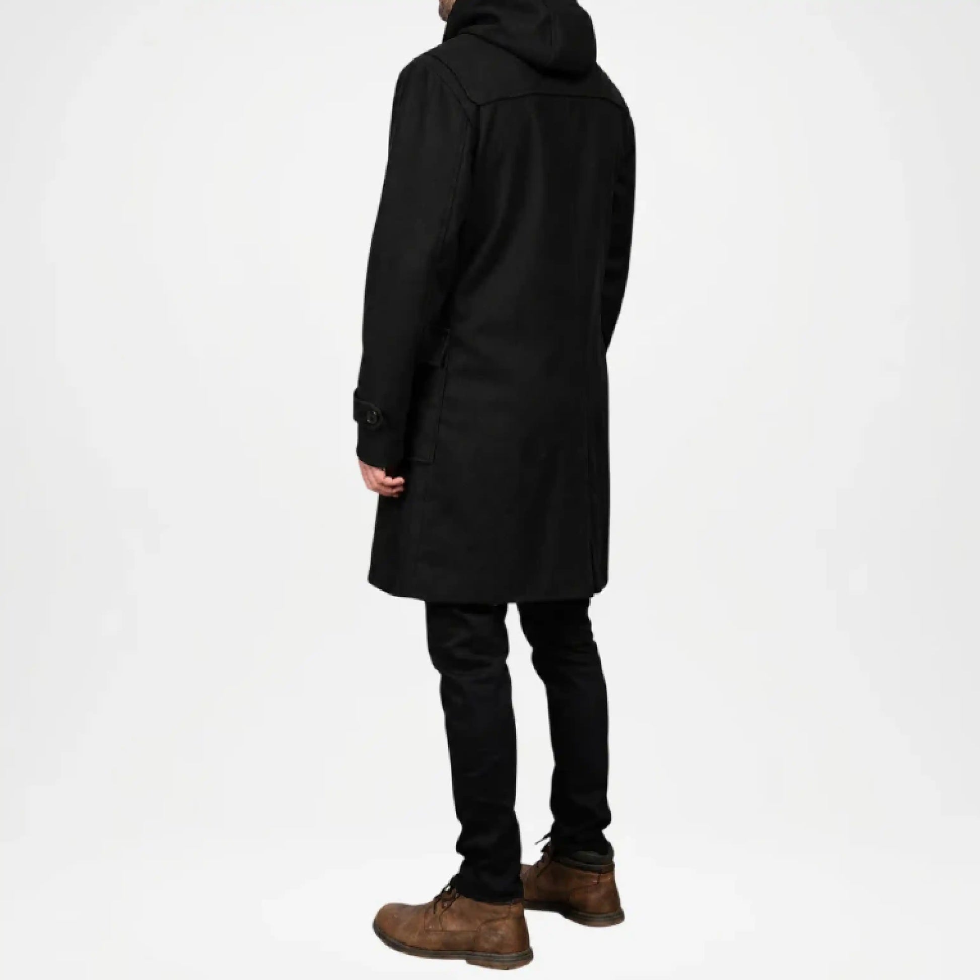 Person wearing a black coat on a white background