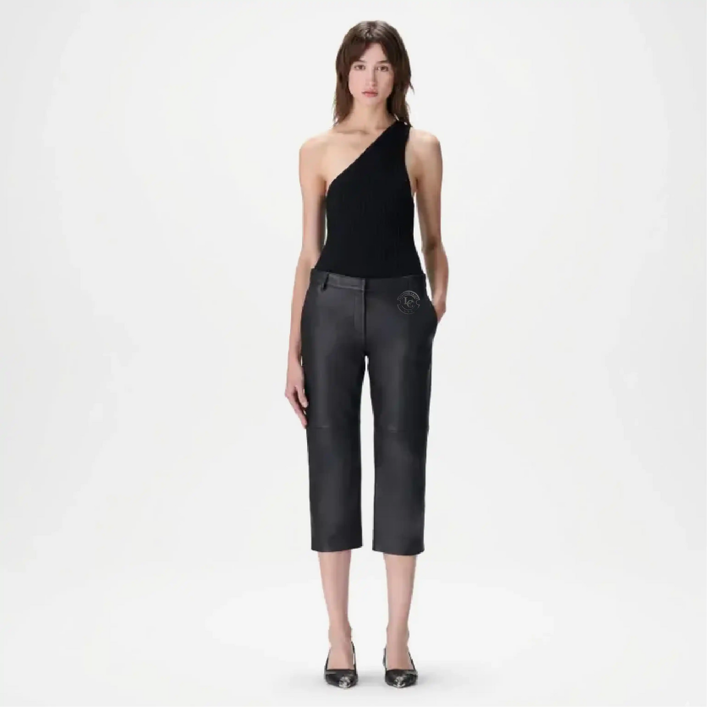 Woman wearing black leather pants and a black top outfit