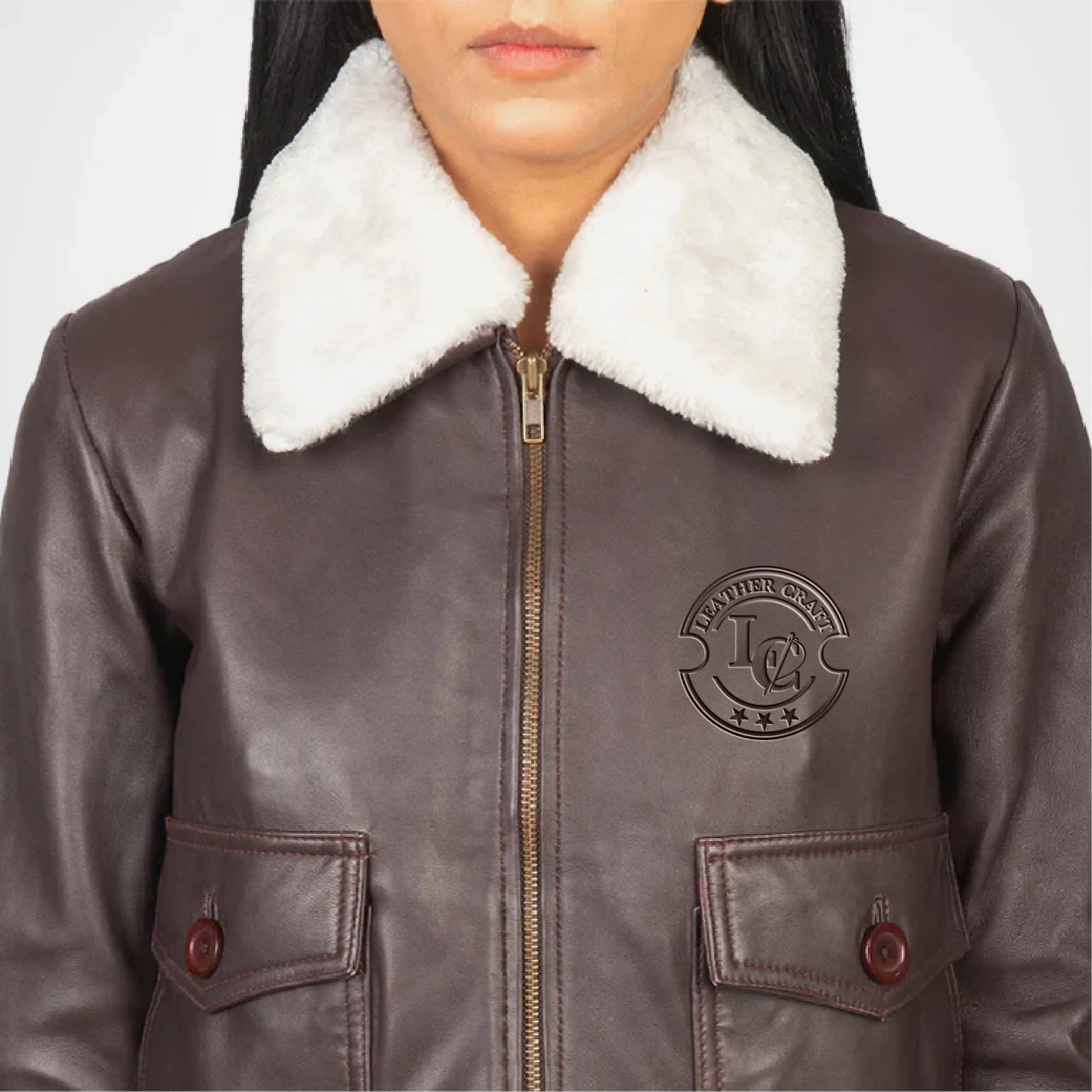 Brown leather jacket with white fur collar and brand logo