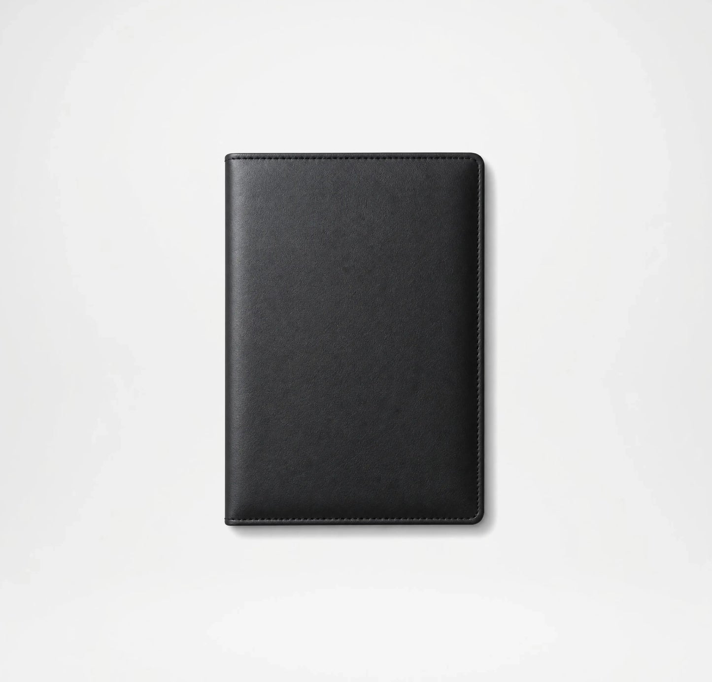 Black leather notebook on a light gray background