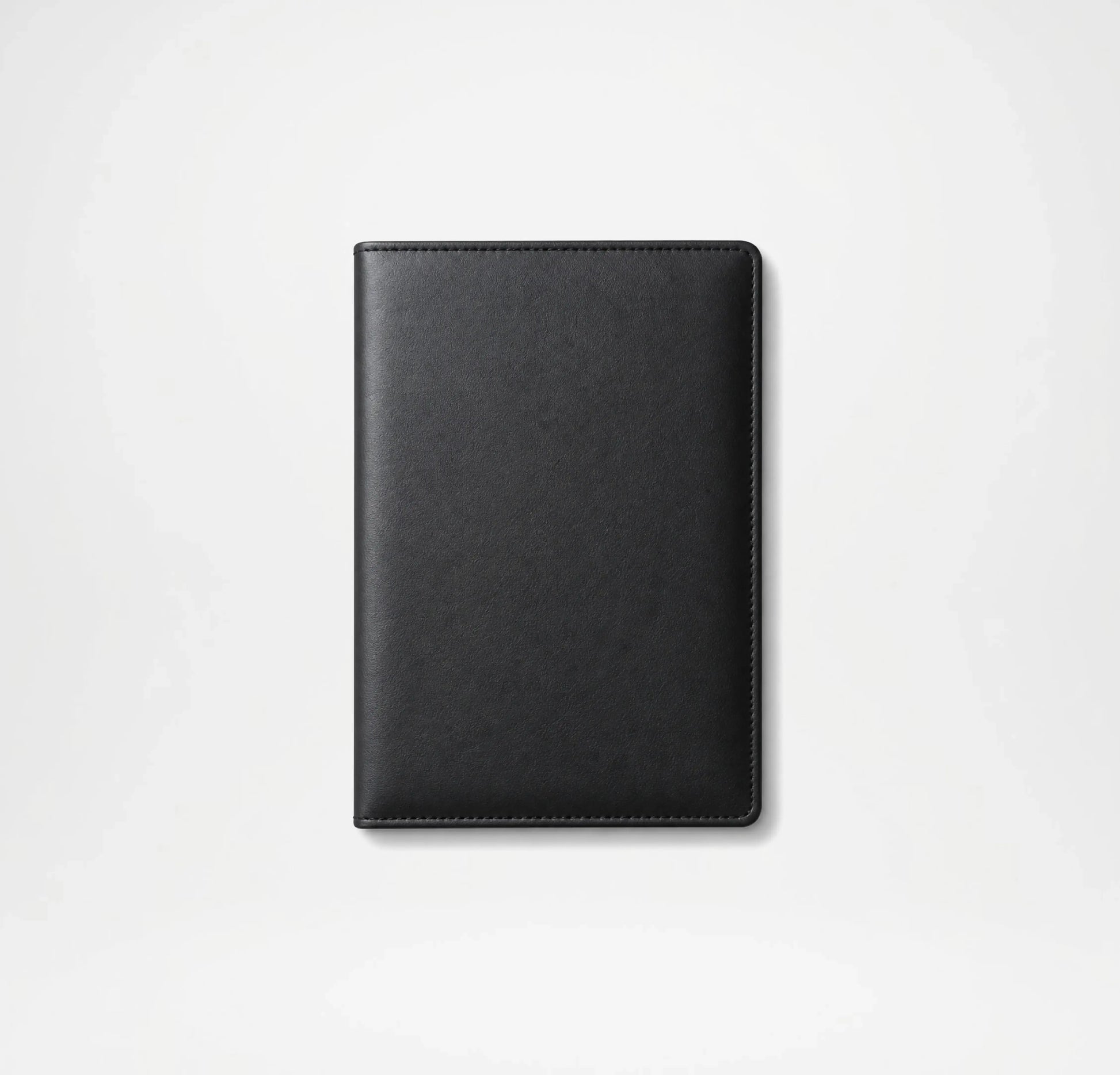 Black leather notebook on a light gray background
