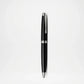 Black pen with silver accents on a white background
