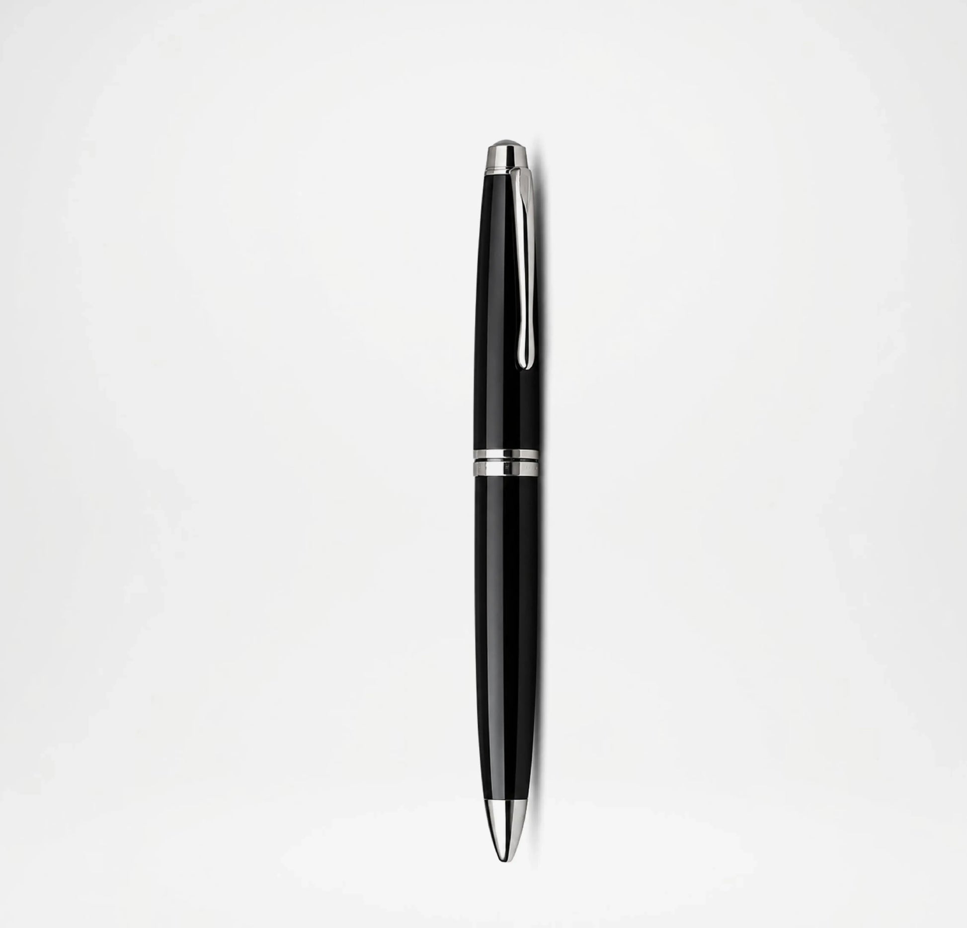 Black pen with silver accents on a white background