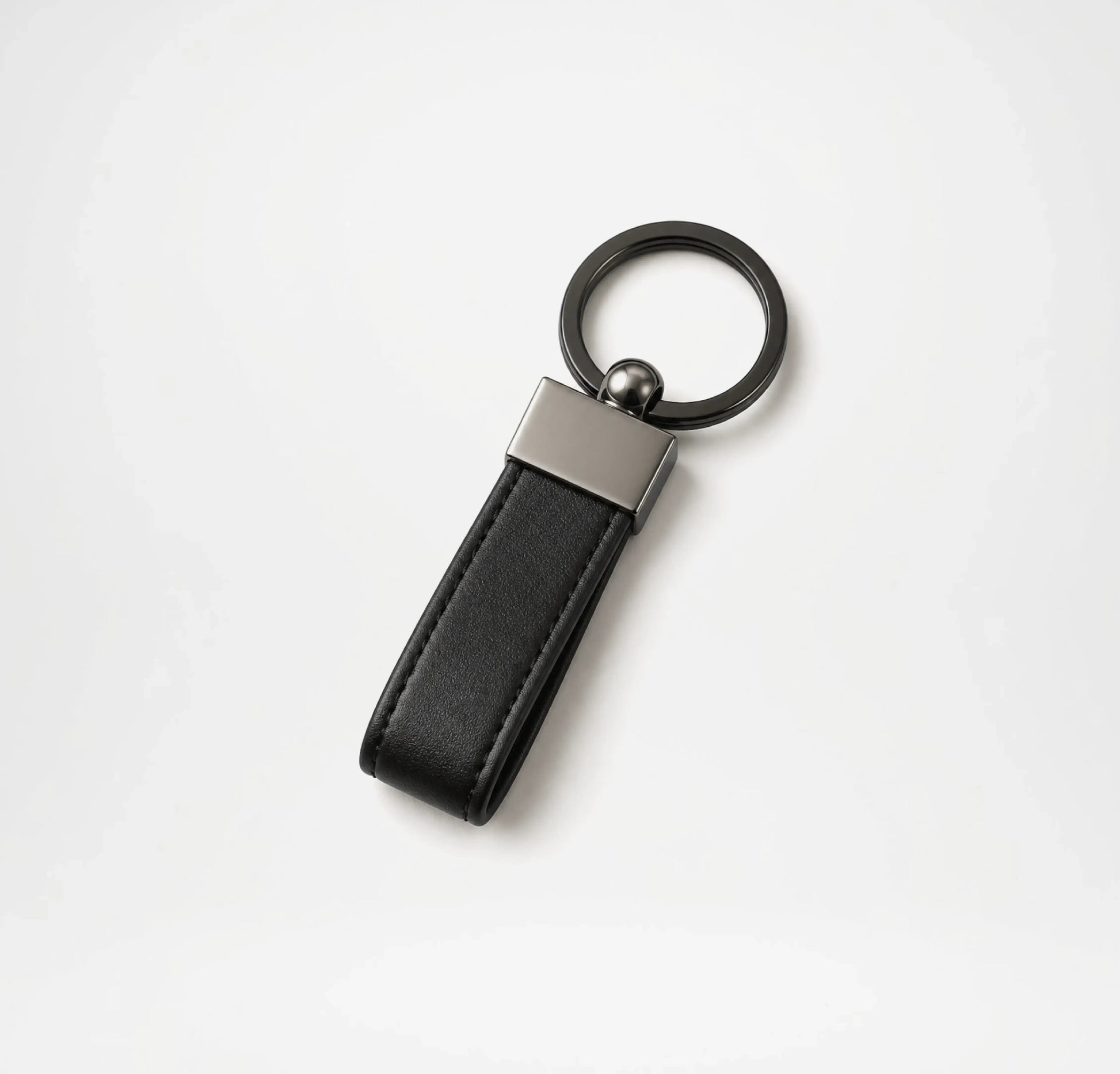 Black leather keychain with metallic accent