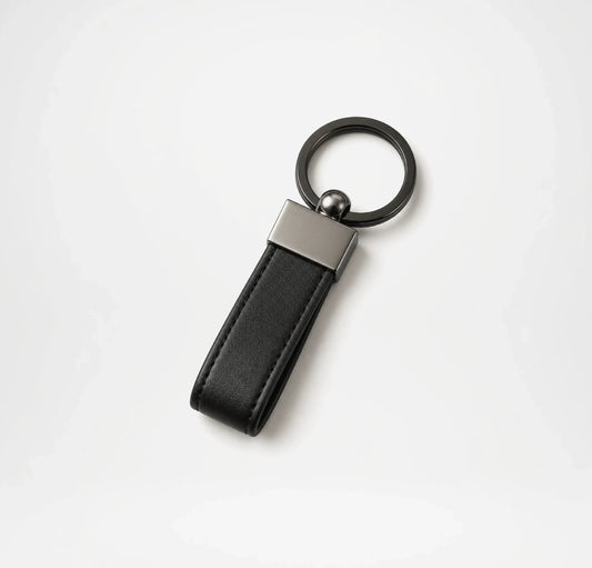 Black leather keychain with metallic accent