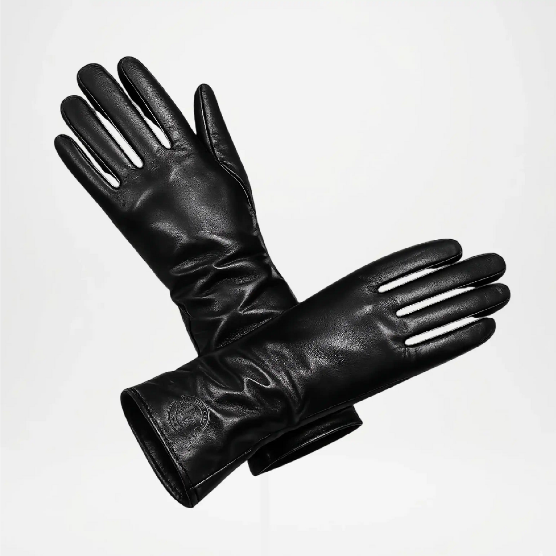 Pair of Long black leather gloves on a white background