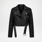 A black faux leather moto jacket with a belted waist, side zipper, and silver-tone hardware, shown against a plain light gray background.