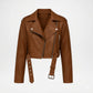 A cropped brown faux-leather moto jacket with a belted waist, silver-tone hardware, and a circular embroidered logo on the chest, displayed on a clean white background.