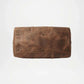 Brown leather bag with rivets