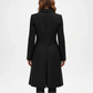 Black coat worn by a person on a white background
