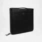 Black leather pouch with zipper on a white background