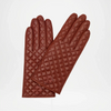 Pair of Brown quilted gloves on a light gray background