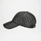 Black cap with decorative elements on a white background