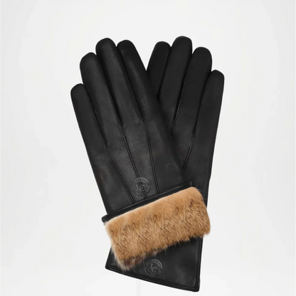 Black leather gloves with brown fur cuff on a light gray background