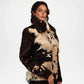 Woman wearing a black and white patterned coat with fur trim on a white background