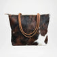 Brown and white cowhide bag with brown leather handle