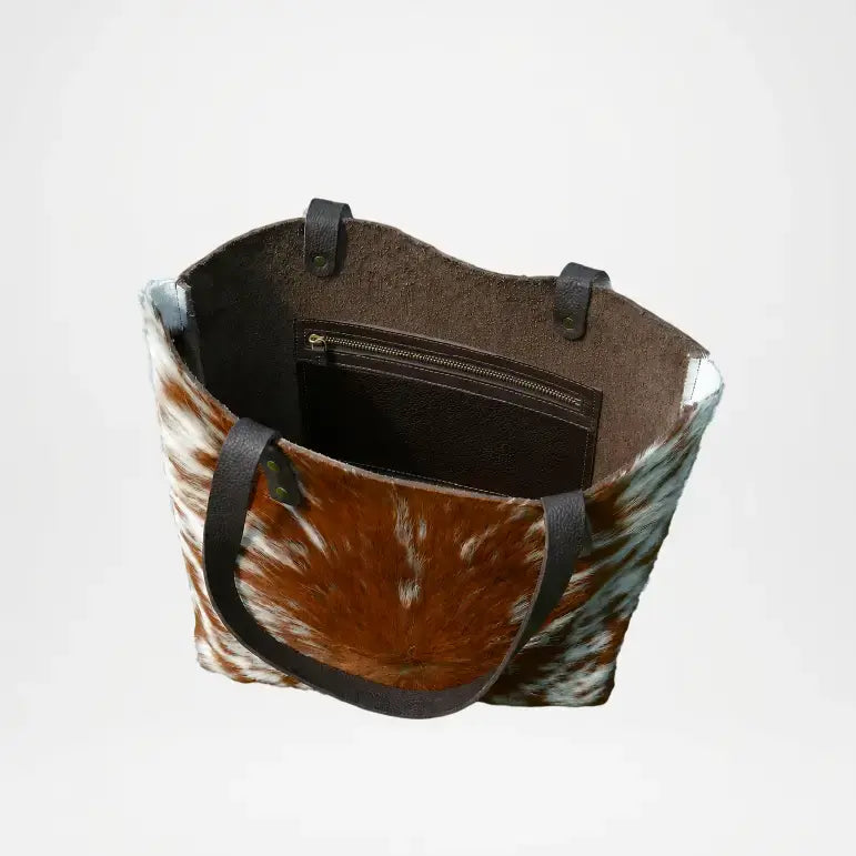 Tote bag with brown and white pattern and black handles