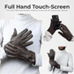Black touchscreen gloves worn by a person with a phone