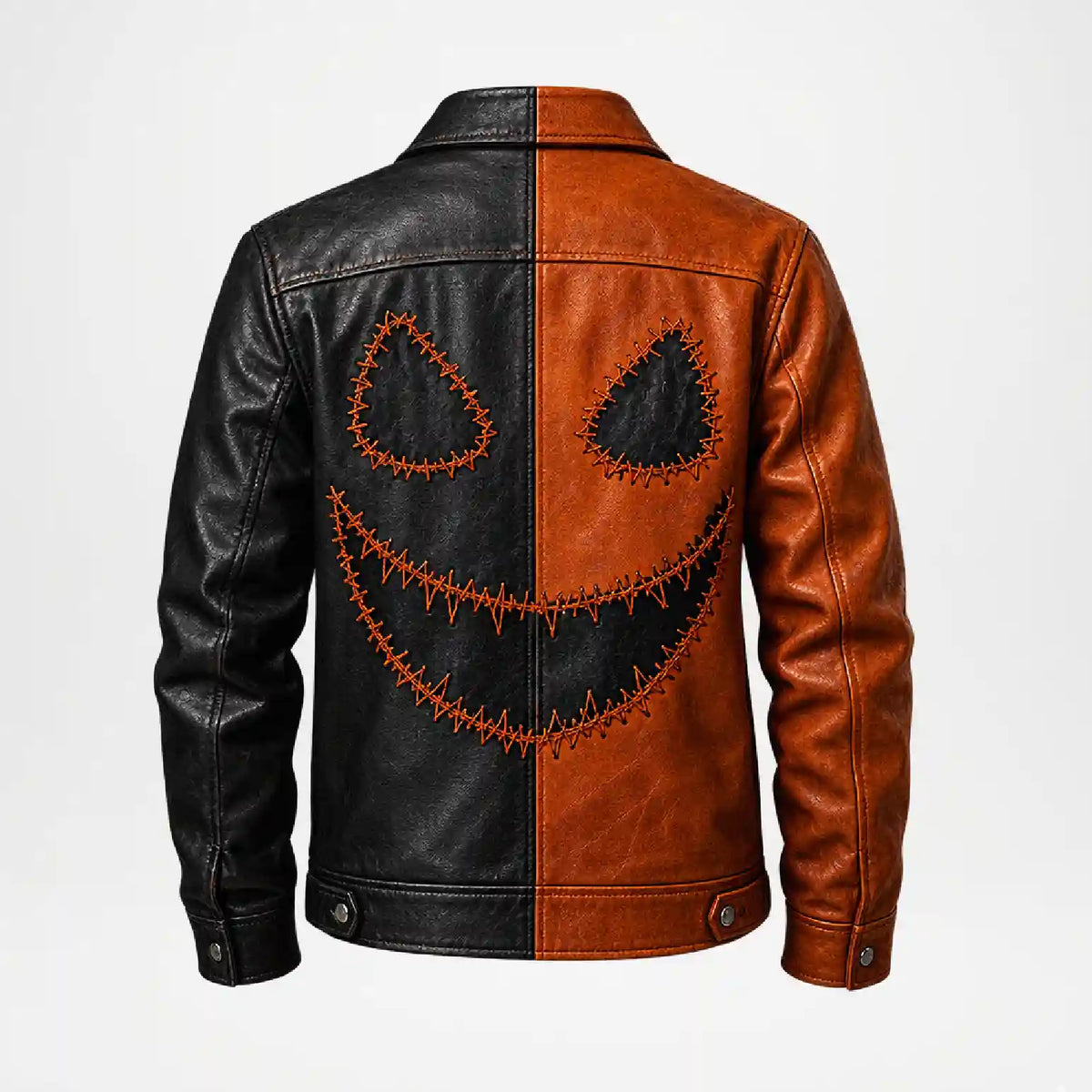 A split-color leather jacket with one half in black and the other in brown, featuring a large stitched jack-o'-lantern face design across the back.