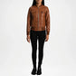 Brown leather jacket worn by a person on a white background