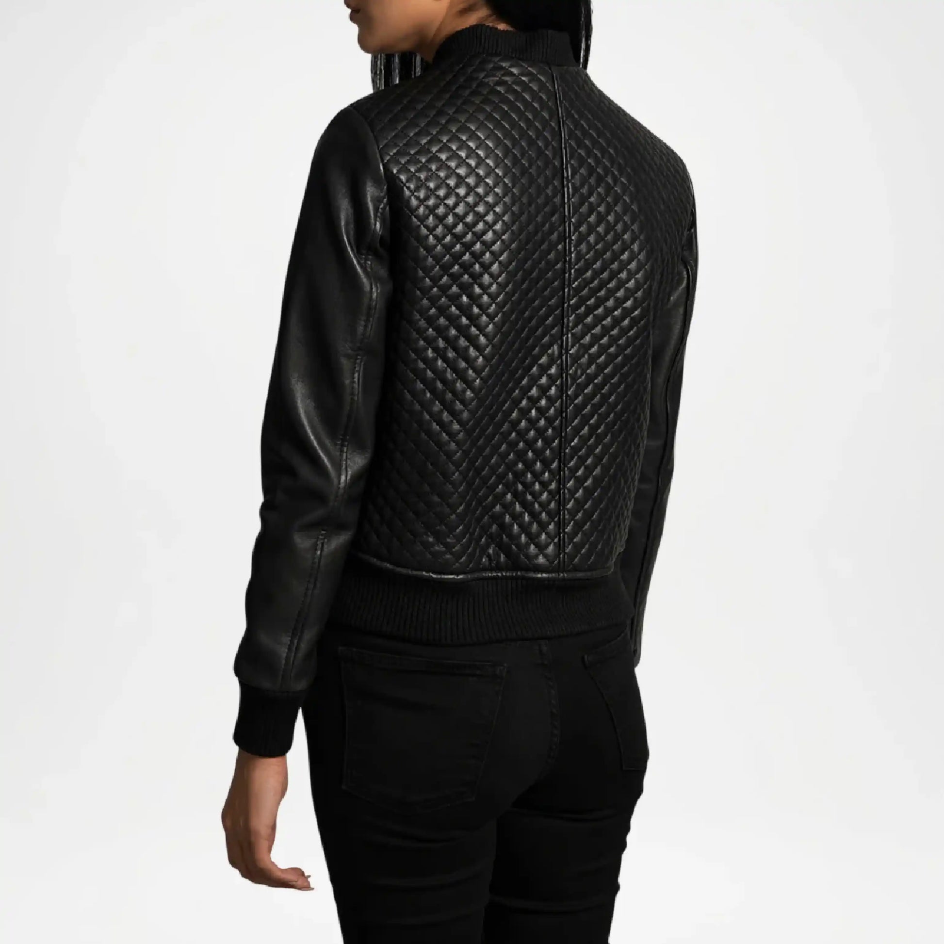 Black quilted leather jacket worn by a person on a white background