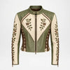 A cropped leather motorcycle jacket featuring olive green and cream panels, brown floral embroidery on the chest and sleeves, and lace-up side detailing, shown against a plain white background.