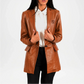 Woman wearing a brown leather jacket on a white background