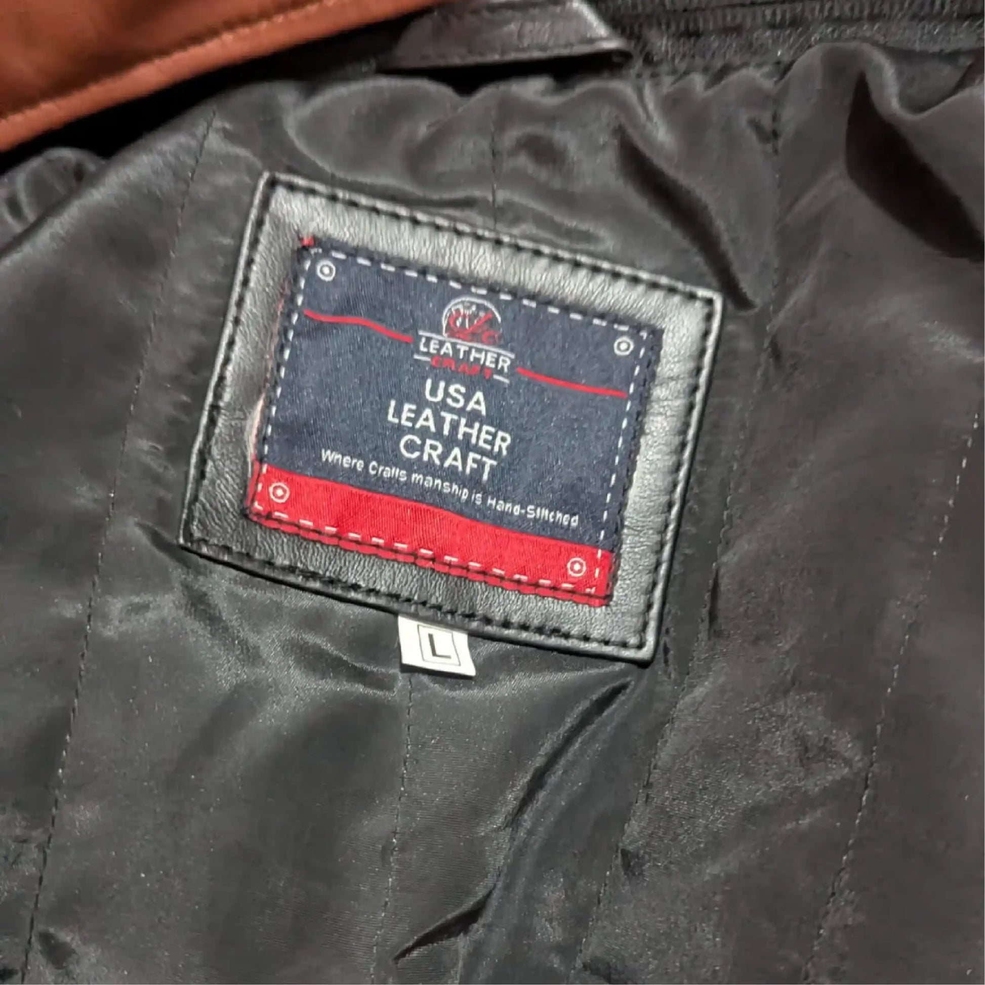 Close-up of a leather craft label on a dark leather surface