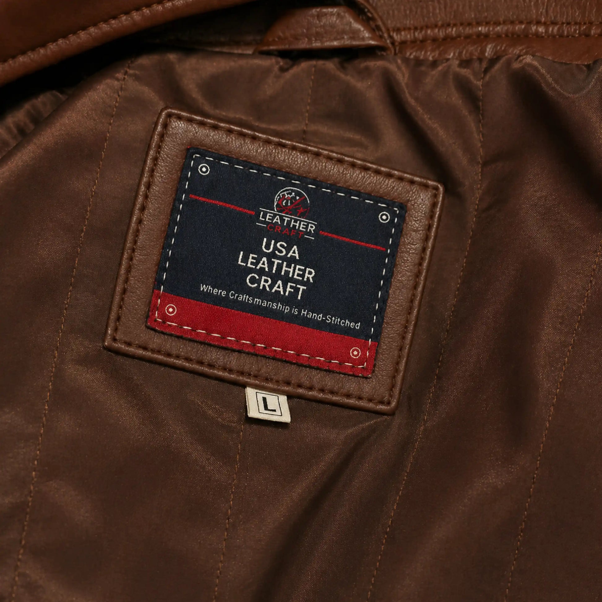 Close-up of a brown leather jacket with a label reading 'USA Leather Craft'.