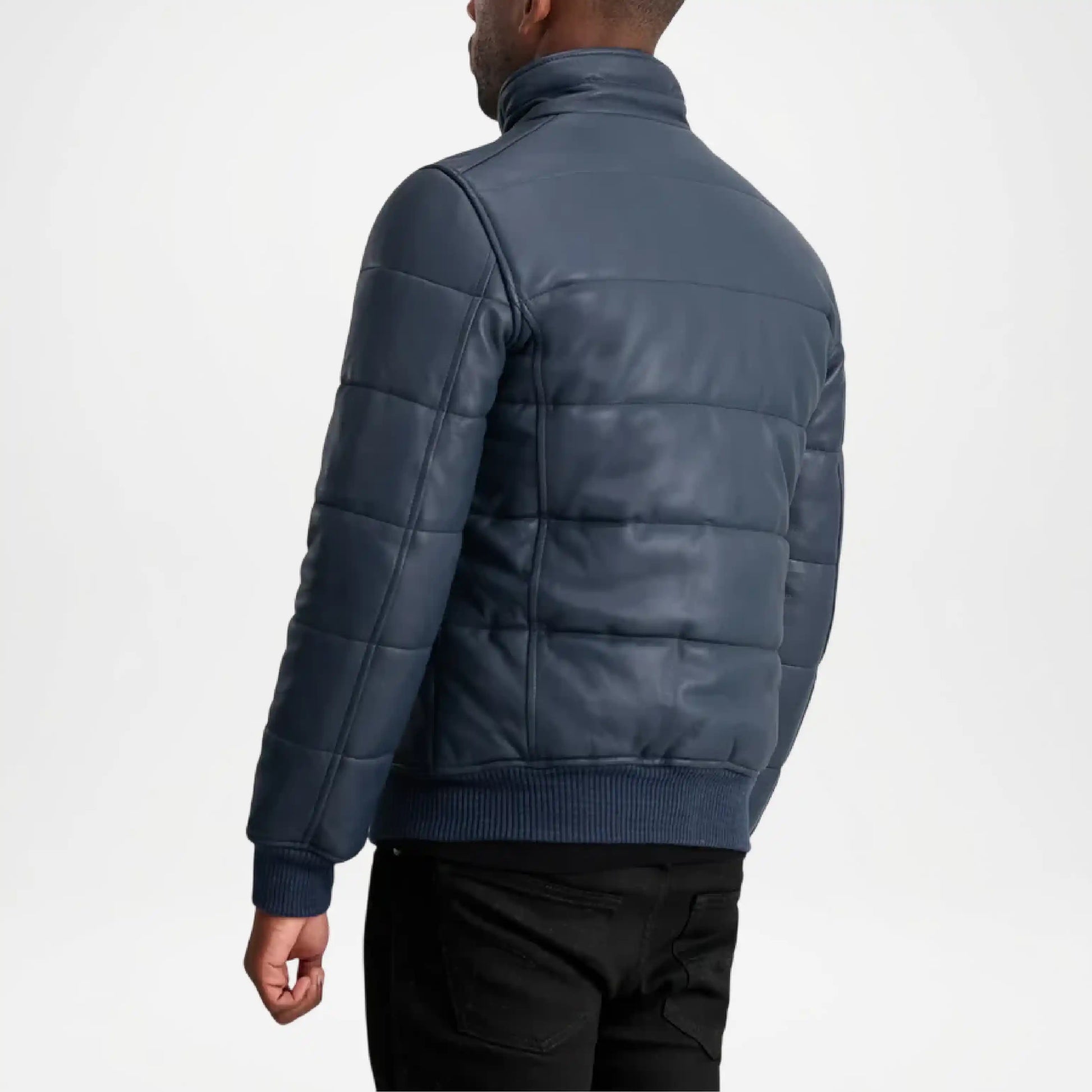 Man wearing a blue puffer jacket on a white background