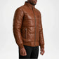 Brown leather jacket with quilted design on a white background