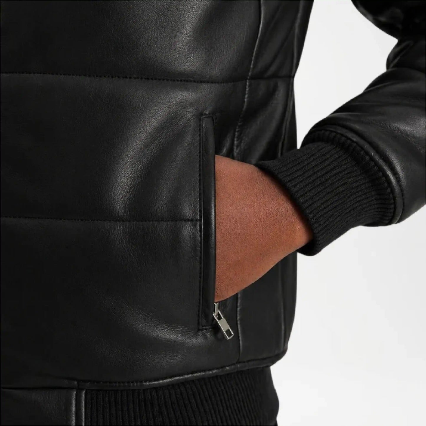 Close-up of a person wearing a black leather jacket with a white background