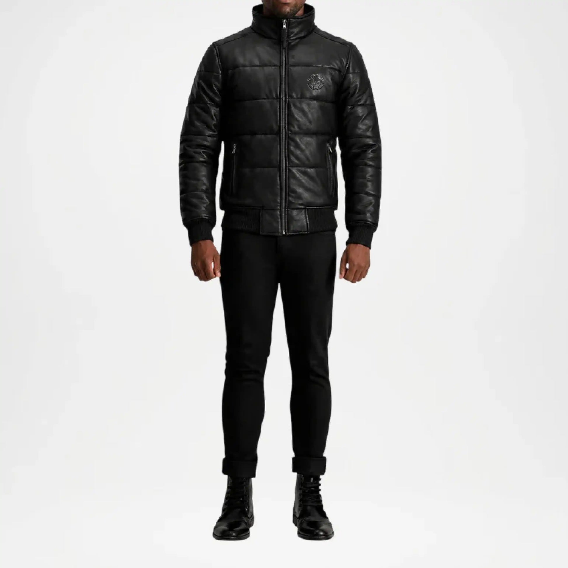 Person wearing a black leather jacket and pants on a white background