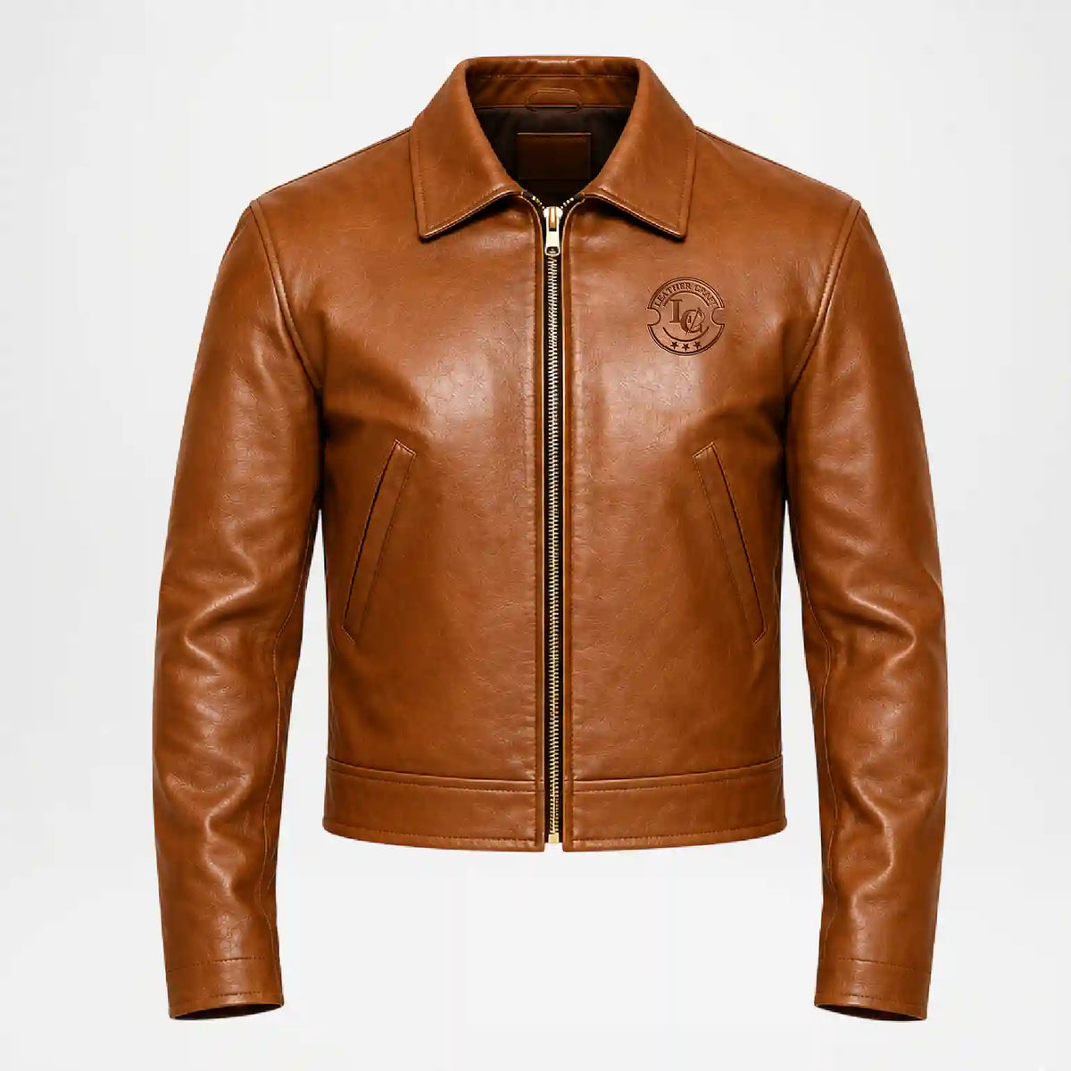A brown leather aviator-style jacket with a front zipper, pointed collar, and a circular embroidered patch on the left chest, shown against a plain light gray background.