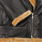 Close-up of a black leather jacket with fur lining on the hood and interior.