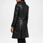 Black leather coat worn by a person on a white background backview