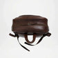 Brown leather backpack on a white background with upper zipper