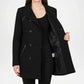 Black coat worn by a person on a white background