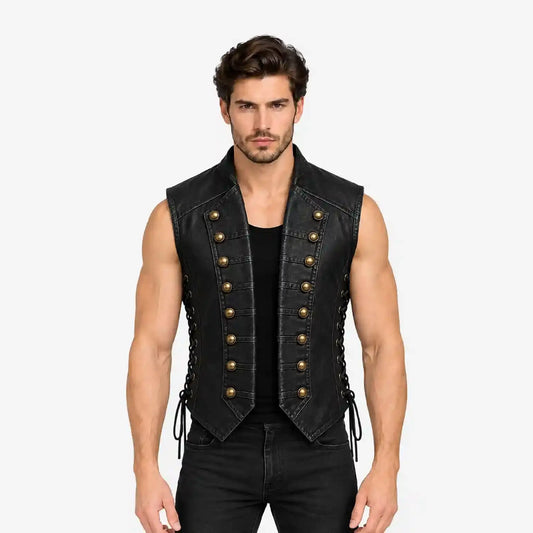 A muscular man wearing a black leather-look sleeveless vest with double rows of gold-tone decorative buttons and side laces, paired with a black shirt and black jeans, against a plain light gray background.