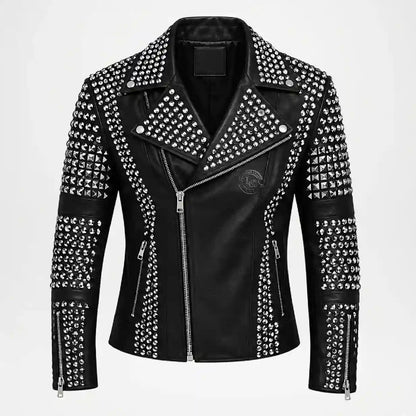 A black faux leather moto jacket heavily embellished with silver studs and pyramid studs, featuring a silver zipper, a pointed collar, and zippered pockets, shown against a plain white background.