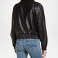 Person wearing a black leather jacket
