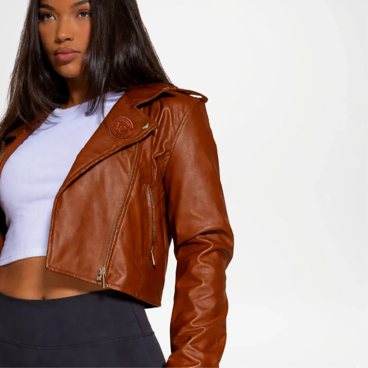 Woman wearing a brown leather jacket on a white background