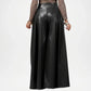Black leather skirt worn by a person on a white background
