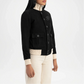 Black cardigan worn by a person on a white background