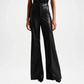 Black leather wide-leg pants worn by a model