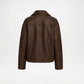 A dark brown faux leather jacket with a distressed finish, shown from the back on a light gray background.
