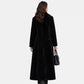 back view of black faux fur coat​ women 