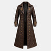 A long brown faux-leather coat with gold-toned buttons, starburst embroidery on the lapels and cuffs, and a black quilted inner lining, shown against a light gray background.