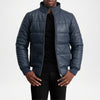 Man wearing a blue puffer jacket on a white background