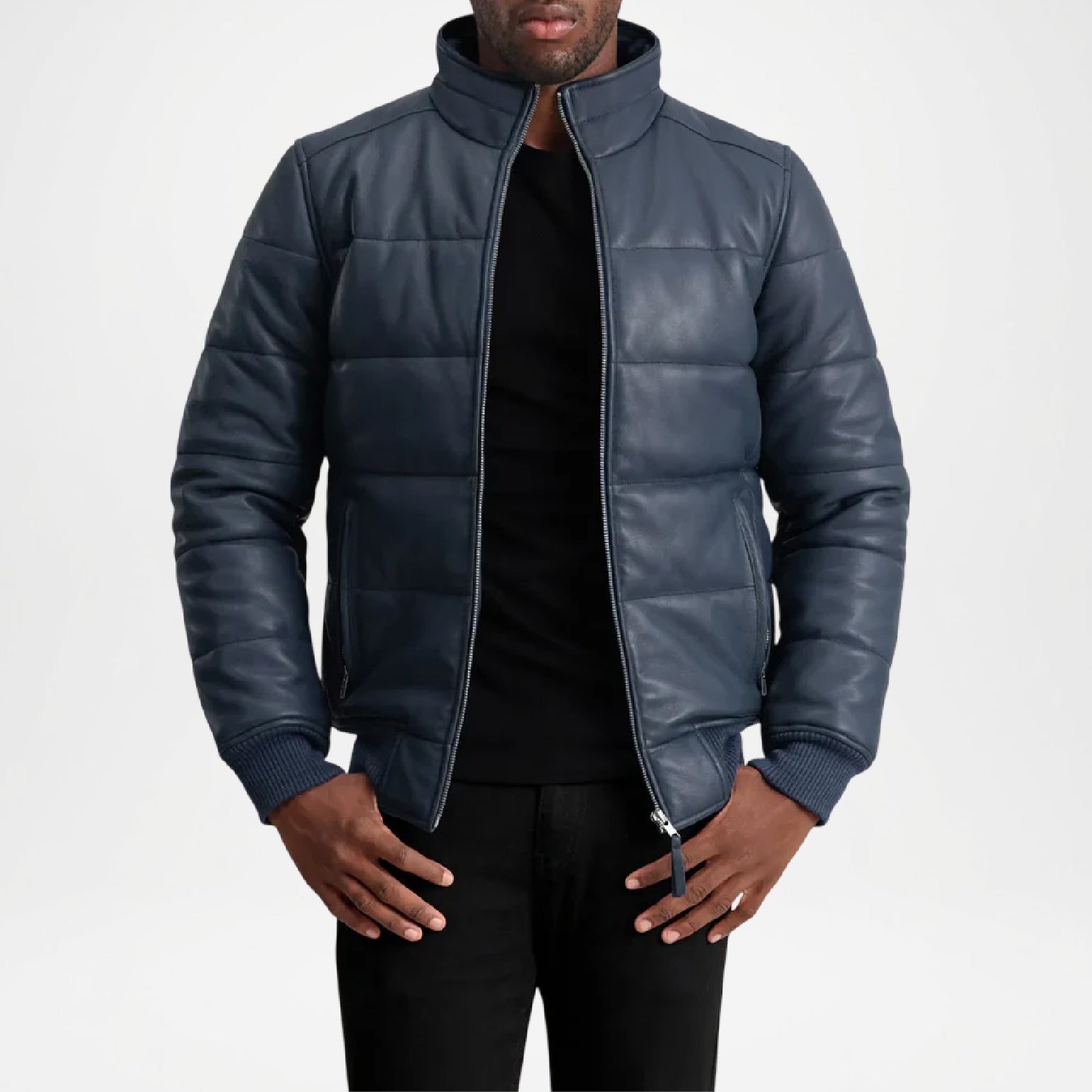 Man wearing a blue puffer jacket on a white background